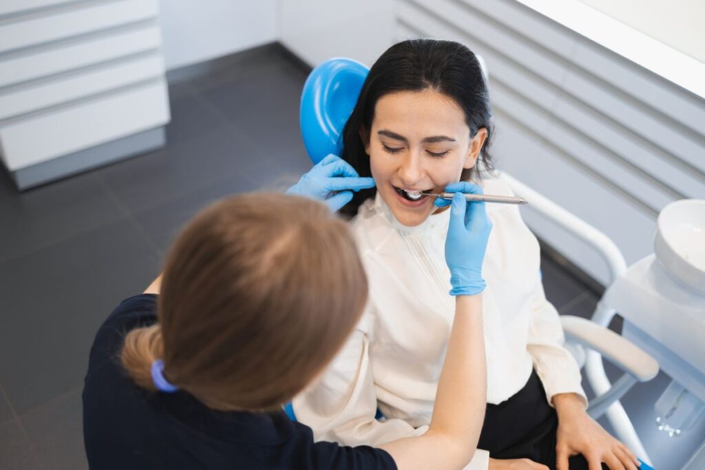 Patient receiving routine dental checkup.