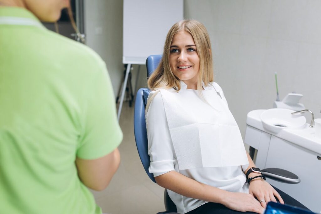 Patient discussing tooth gap treatment with a dentist.