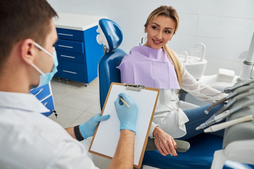 Patient discussing oral health concerns with a dentist.