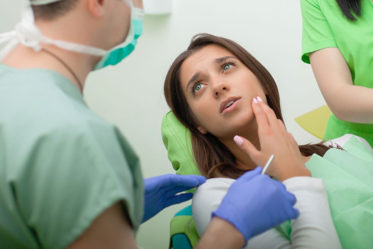 Patient receiving emergency dental care for a damaged tooth.