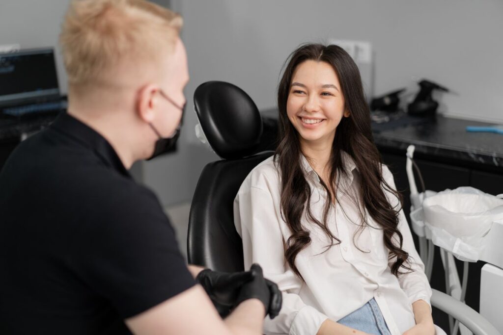 Patient consulting a dentist about teeth whitening.