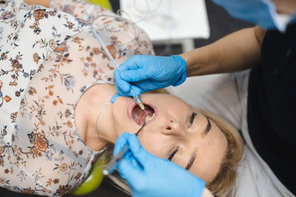 Patient receiving a dental exam for bleeding gums and early gum disease detection.